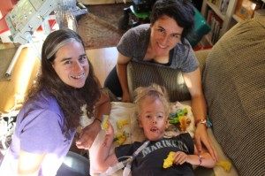 With Alexis and Mackenzie, enjoying new finger-puppet dinosaurs