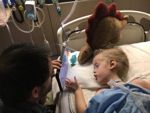 Lucas and Daddy and Stanley checking Lucas's email post-op.